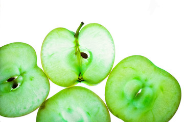 Slices of apple at the backlight isolated on a white background, macro photo