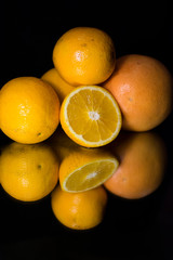 Large cut orange. Natural vitamins close up. Several oranges on a background from a wicker vine.