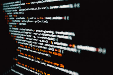Horizontal shot of some programming code written in white over black
