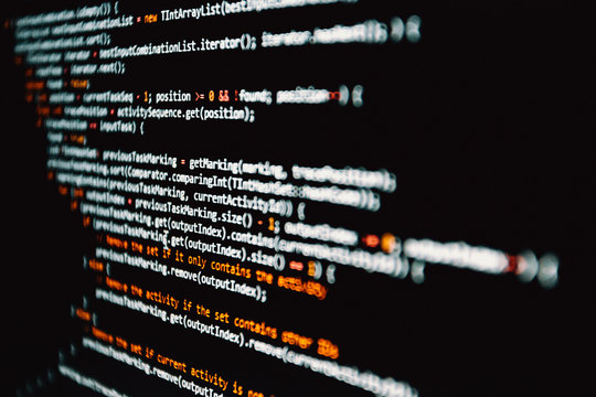 Horizontal shot of some programming code written in white over black