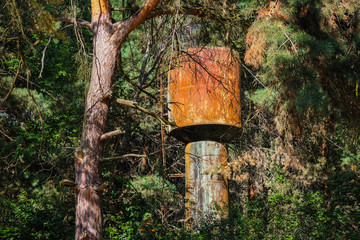 Rusty Water Tower. Old inactive rusty water tower in the cottage village of Lake Svityaz, Volyn region, Ukraine. Shatsky national natural park.