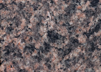 Texture of pink Baltic granite with quartz and mica feldspar granules