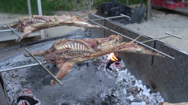Giant barbecue with roast lamb.