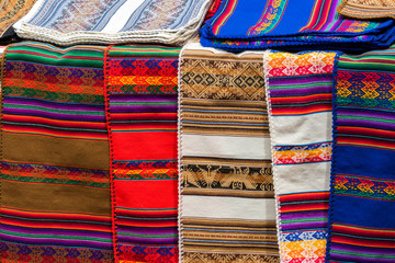 Peruvian traditional colourful handicraft textile fabric in Cusco, Peru - obrazy, fototapety, plakaty