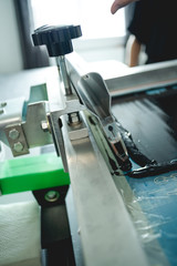 Close up of details of screen printing machine in designer studio 