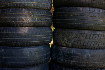 Obraz premium Old used car tires close-up. Used car tires background.