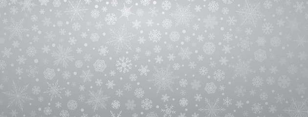 Christmas background of various complex big and small snowflakes, in gray colors