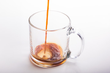 Black Coffee Poured in glass mug on white surface