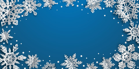 Christmas background with volume paper snowflakes with soft shadows on light blue background