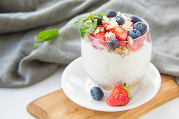 Healthy blueberry, strawberry and walnut parfait in a glass 