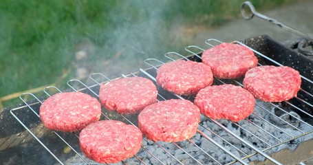 Beef and Pork Patty for Burger. Cooking Cutlets on Mangal. Grill Minced Meat. Chef Cooks burger in...