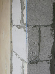 A blue string, established by the use of a plumb bob or plummet, used as a vertical reference line for wall in construction