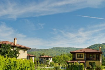 Modern houses along the beautiful Mediterranean coast with mountain range. Marmaris Datca Turkey. 