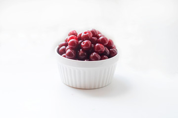Red cherries laid out in even rows. Background. Harvest of red cherries in a season.