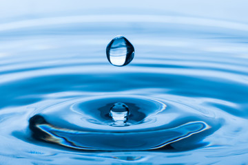 Water drop splash. Blue water	