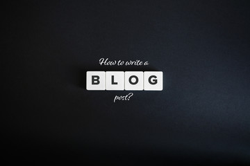 How to write a blog post banner. Block letters on the black paper background Minimal aesthetics.