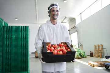 Pleased warehouse worker looking into the distance