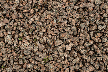 Texture of granite stones on the ground.