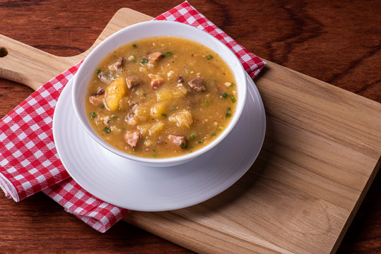 .Cassava broth. Creamy broth made with cassava, sausage, bacon and meat. Top view