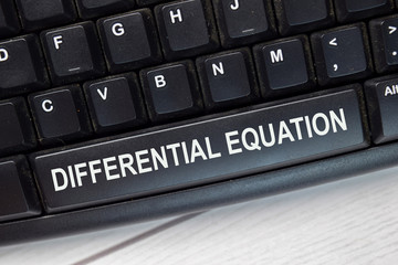 Differential Equation text write on keyboard isolated on laptop background