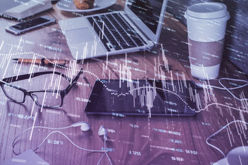 Double exposure of forex chart drawing and cell phone background. Concept of financial trading