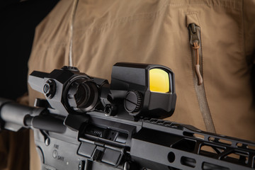 Optical sight on a modern automatic carbine. Reflex sight mounted on the weapon