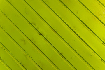 the surface of the wooden slats is painted yellow