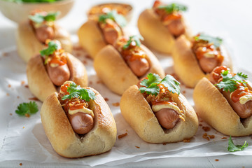 Spicy mini hot dogs with pork sausage and sauce