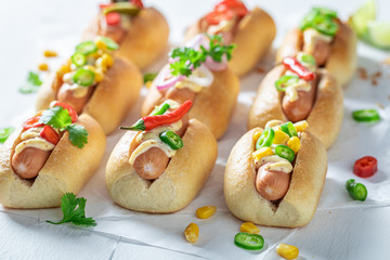 Delicious mini hot dogs with pork sausage and sauce