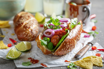 Tasty barbecue hot dogs with with sauce and grilled sausage