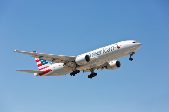 Chicago, USA - August 21, 2020: An American Airlines Boeing 777 landing at O'Hare International Airport.