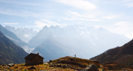 Amazing view on Monte Bianco mountains range with cabin and tourist on a foreground. Vallon de...