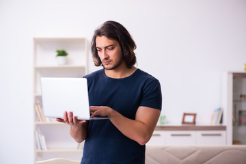Fototapeta premium Young man employee working from house