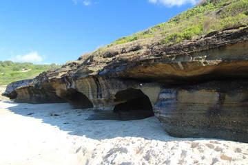 Small Cave in a Cliff by a Beach