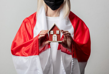 woman with national Belarus flag and  home symbol on white background