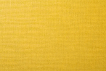 黄色い絹目調の質感のある紙の背景テクスチャー