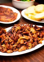 
grilled chicken, grilled pork plus potatoes