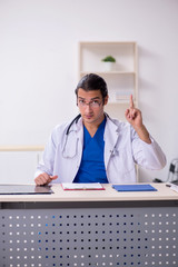 Young doctor working in the hospital