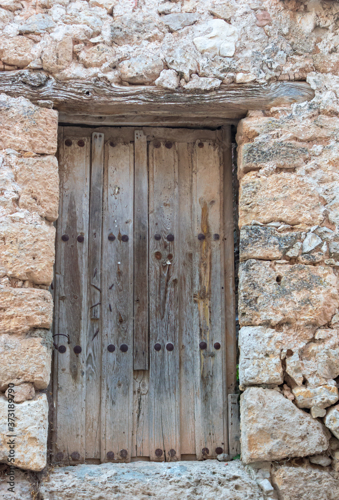 Poster Old abandoned building with broken doors and weathered walls