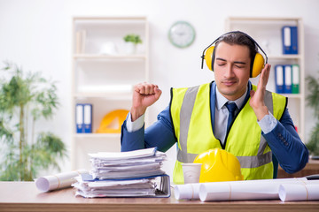 Young male architect working in the office