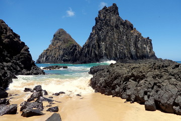 beach with rocks and mountains