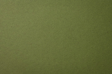 オリーブグリーンのクラフト紙の背景テクスチャー