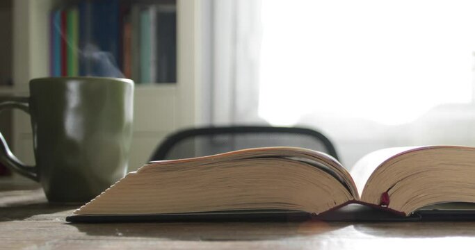 reading book with coffee cup