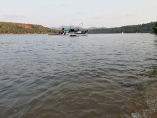 Fototapeta na wymiar fishing boats in the harbor, fishing boats on the river, Indian river. 