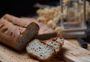 Sliced homemade bread on wooden board