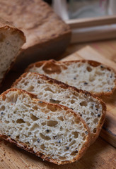Sliced homemade bread on wooden board
