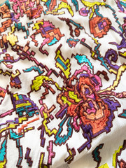 Closeup on traditional inspired tribal style colorful embroidery on fashion garment