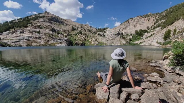 Woman sitting by the beautiful Liberty Lake