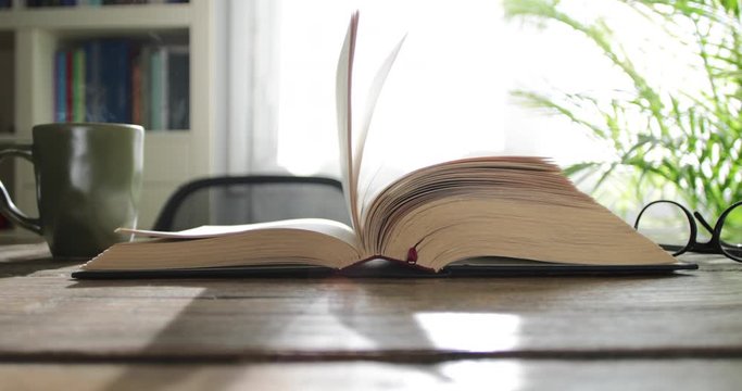 reading book with coffee cup