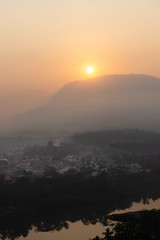 Sunrise and mist over Luang Prabang, Laos from Mount Phousi